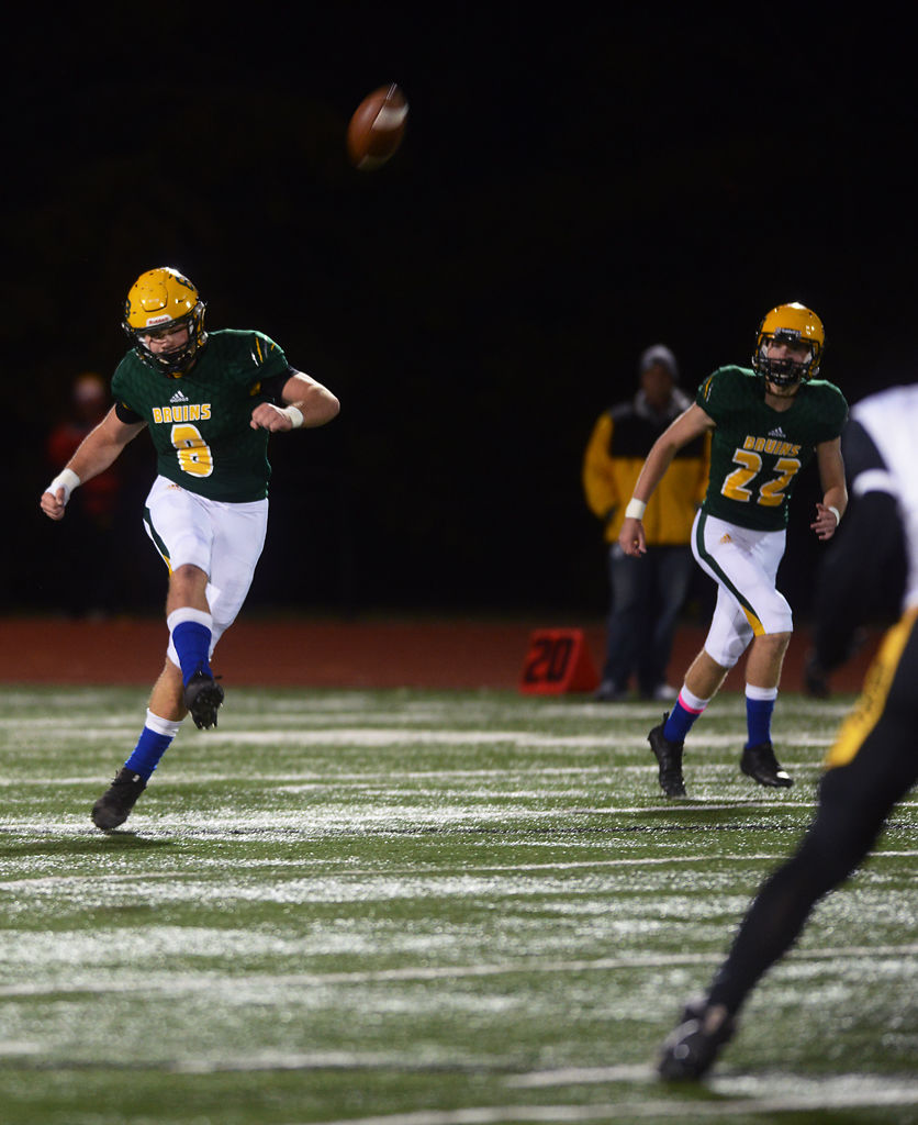 Will Norris kicks the ball upfield